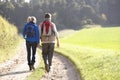 Young couple walking in park Royalty Free Stock Photo