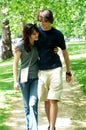 Young couple walking in park Royalty Free Stock Photo