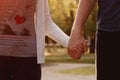 Young couple walking in the park holding hands