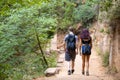 Young couple walking side by side down a hiking trail Royalty Free Stock Photo