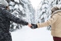 Young Couple Walking In Snow Forest Outdoor Man And Woman Holding Hands Back View Royalty Free Stock Photo