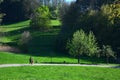 A young couple walking on a trail in a beautiful landscape in spring in the Odenwald, Germany Royalty Free Stock Photo