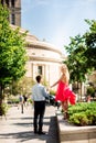 Young couple walking in Warsaw. Blonde woman in red dress having fun with her man. Love story Royalty Free Stock Photo