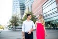 Young couple walking in Warsaw. Blonde woman in red dress having fun with her man. Love story Royalty Free Stock Photo