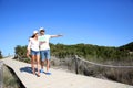 Young couple walking on a wooden pontoon Royalty Free Stock Photo