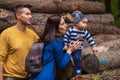 A young couple walks in the woods with a little boy Royalty Free Stock Photo