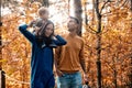 A young couple walks in the woods with a little boy Royalty Free Stock Photo