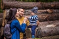 A young couple walks in the woods with a little boy Royalty Free Stock Photo