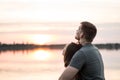 Young couple watching the sunset together Royalty Free Stock Photo