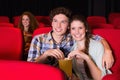 Young couple watching a film