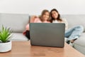 Young couple watching film sitting on the sofa at home Royalty Free Stock Photo