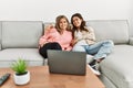 Young couple watching film sitting on the sofa at home Royalty Free Stock Photo