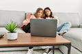 Young couple watching film sitting on the sofa at home Royalty Free Stock Photo