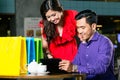 Young couple watching a funny video on a tablet connected to the internet