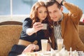 Young couple watching photos on a mobile phone Royalty Free Stock Photo