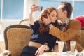 Young couple watching photos on a mobile phone Royalty Free Stock Photo