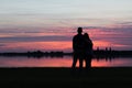 Young couple watching the sunset together Royalty Free Stock Photo