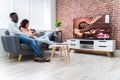 Young Couple Watching Television Royalty Free Stock Photo