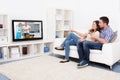 Young couple watching television Royalty Free Stock Photo