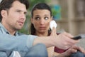 young couple watching tv in evening at home Royalty Free Stock Photo