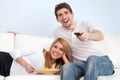 Young couple watching tv at home Royalty Free Stock Photo