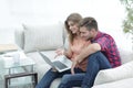 Young couple watching videos on laptop Royalty Free Stock Photo