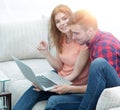 Young couple watching videos on laptop Royalty Free Stock Photo