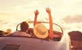 Young Couple Wathcing the Sunset in Vintage Sports Car