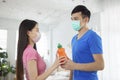 Young couple wear with medical mask workout together and holding water bottle