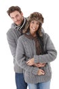 Young couple wearing the same sweater smiling Royalty Free Stock Photo