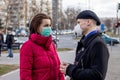 Young couple wearing two types of protective masks for protection from coronavirus. Royalty Free Stock Photo