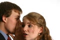 Young Couple whispering at work Royalty Free Stock Photo