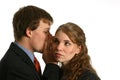 Young Couple whispering at work Royalty Free Stock Photo