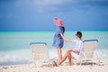 Young couple on white beach during summer vacation. Happy family enjoy their honeymoon Royalty Free Stock Photo