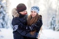 Young couple in the winter park