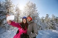 Couple on winter taking photo outdoor