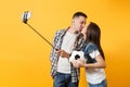 Kiss couple, woman man, football fans doing selfie on mobile phone with monopod selfish stick, cheer up support team Royalty Free Stock Photo