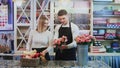 Young couple work at flower shop. Royalty Free Stock Photo