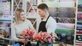 Young couple work at flower shop. Royalty Free Stock Photo