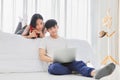 Young couple working online from home in the bedroom together during quarantine for new normal and social distancing