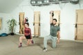 Young Couple Workout Kettlebell Fitness Exercise In The Gym, Selective Focus