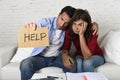 Young couple worried at home in bad financial situation stress asking for help Royalty Free Stock Photo