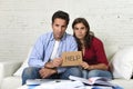 Young couple worried at home in bad financial situation stress asking for help Royalty Free Stock Photo