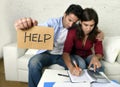 Young couple worried at home in bad financial situation stress asking for help Royalty Free Stock Photo