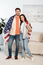 Young couple wrapping in american flag Royalty Free Stock Photo