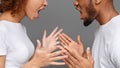 Young couple yelling at each other in studio Royalty Free Stock Photo