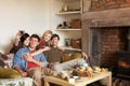 Young couples in cosy cottage Royalty Free Stock Photo