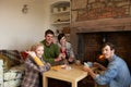 Young couples in cosy cottage Royalty Free Stock Photo