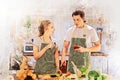 Young couples are enjoying cooking at the kitchen in working from home, COVID-19