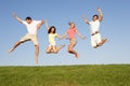 Young couples jumping in air Royalty Free Stock Photo